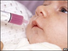 Baby being given liquid paracetamol